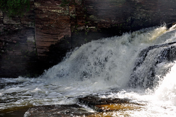 Lee Duquette feeling the water at Nawadaha Falls